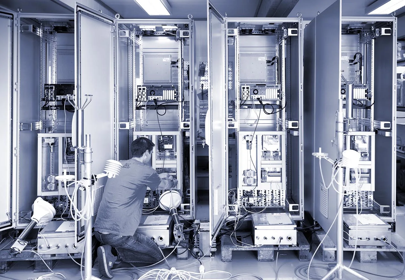WISE Group engineer wiring an Orbalux monitoring cabinet